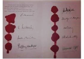 A document featuring several handwritten signatures and red wax seals arranged in two vertical columns, with faint printed text visible at the top left.